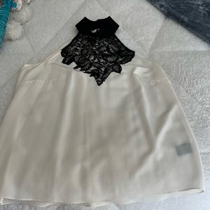 Nicole Miller, White silk halter top with lace insert at neck.